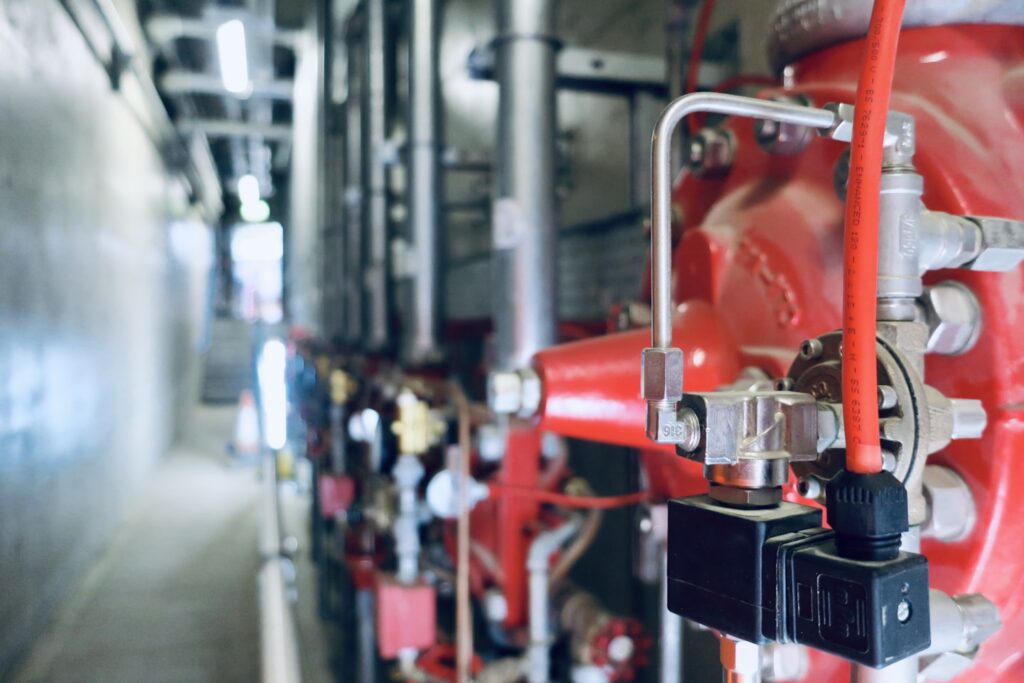 Fire pump and valve set in a commercial building plant room
